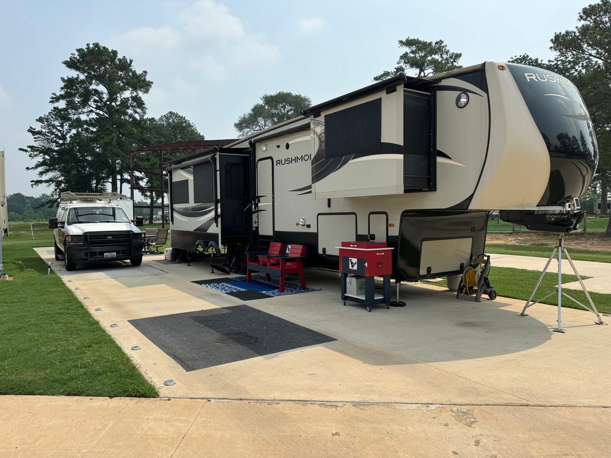 Concrete pad and shaded RV site at Hidden Lake RV Resort