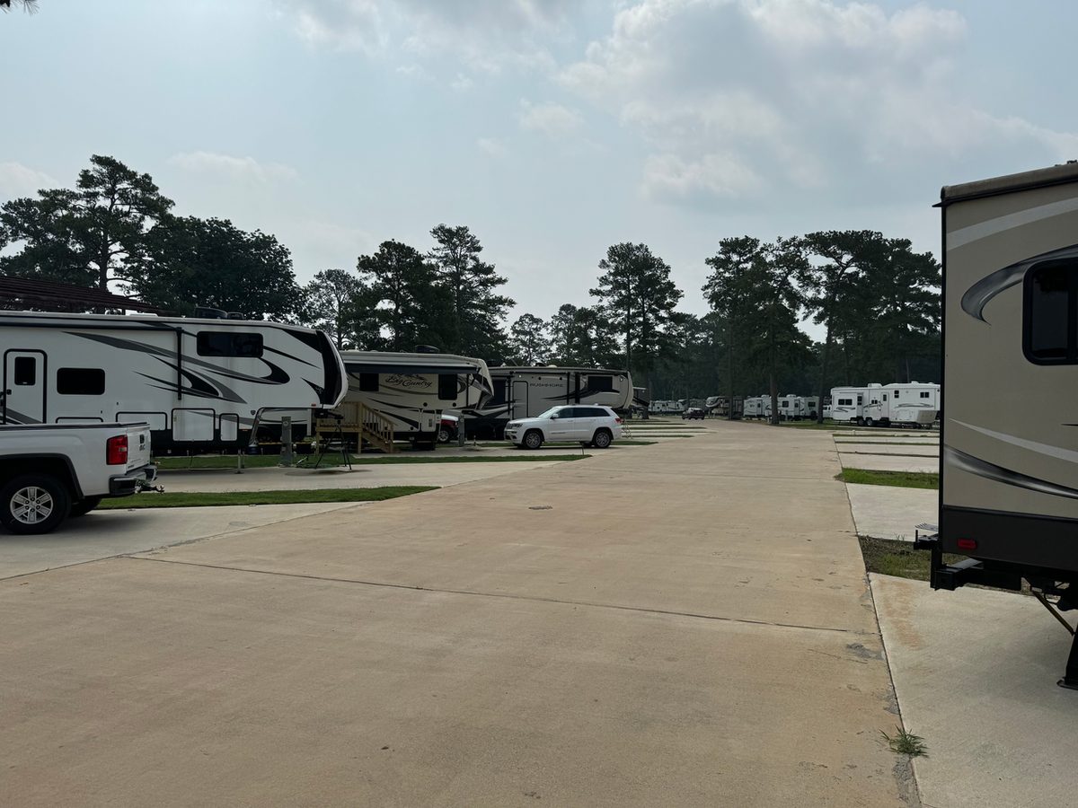 RV site with grassy area at Hidden Lake RV Resort