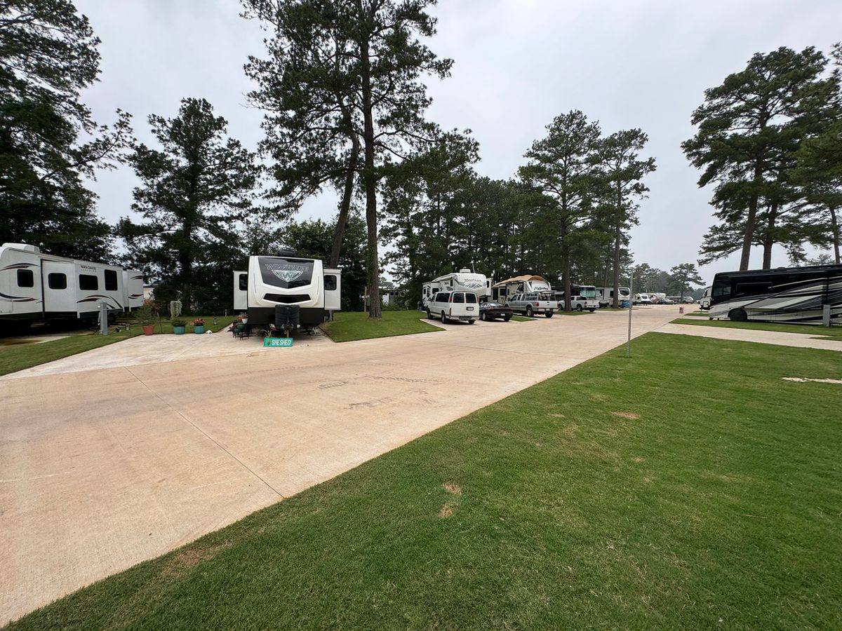 Wide view of RV sites and concrete roads at Hidden Lake RV Resort