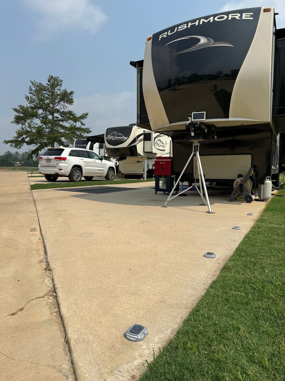 Large RV parked at a Hidden Lake RV Resort site