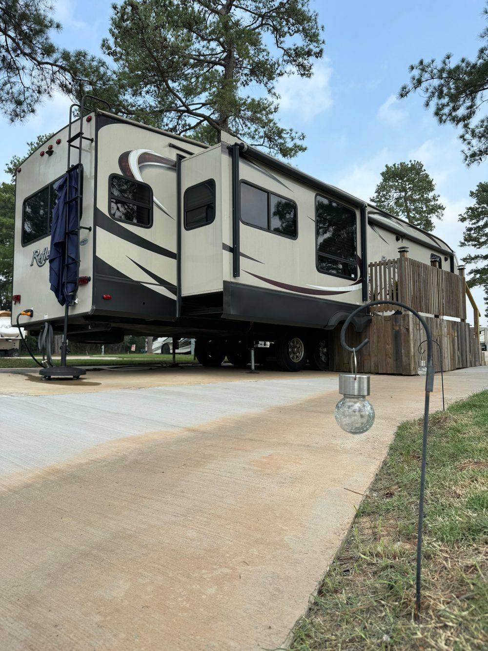 RV site with landscaping at Hidden Lake RV Resort